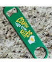 Green bottle opener with humorous text and design on a speckled countertop